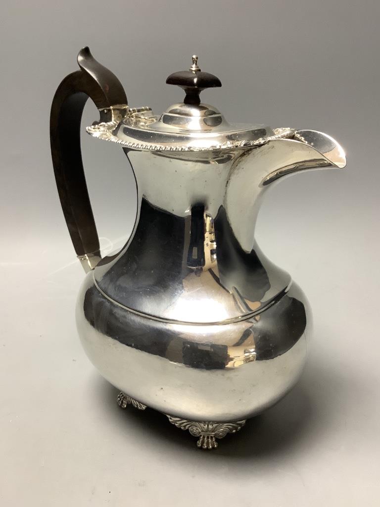 A London shape silver hot water pot with ebonised handle and finial, approx gross 12.6oz